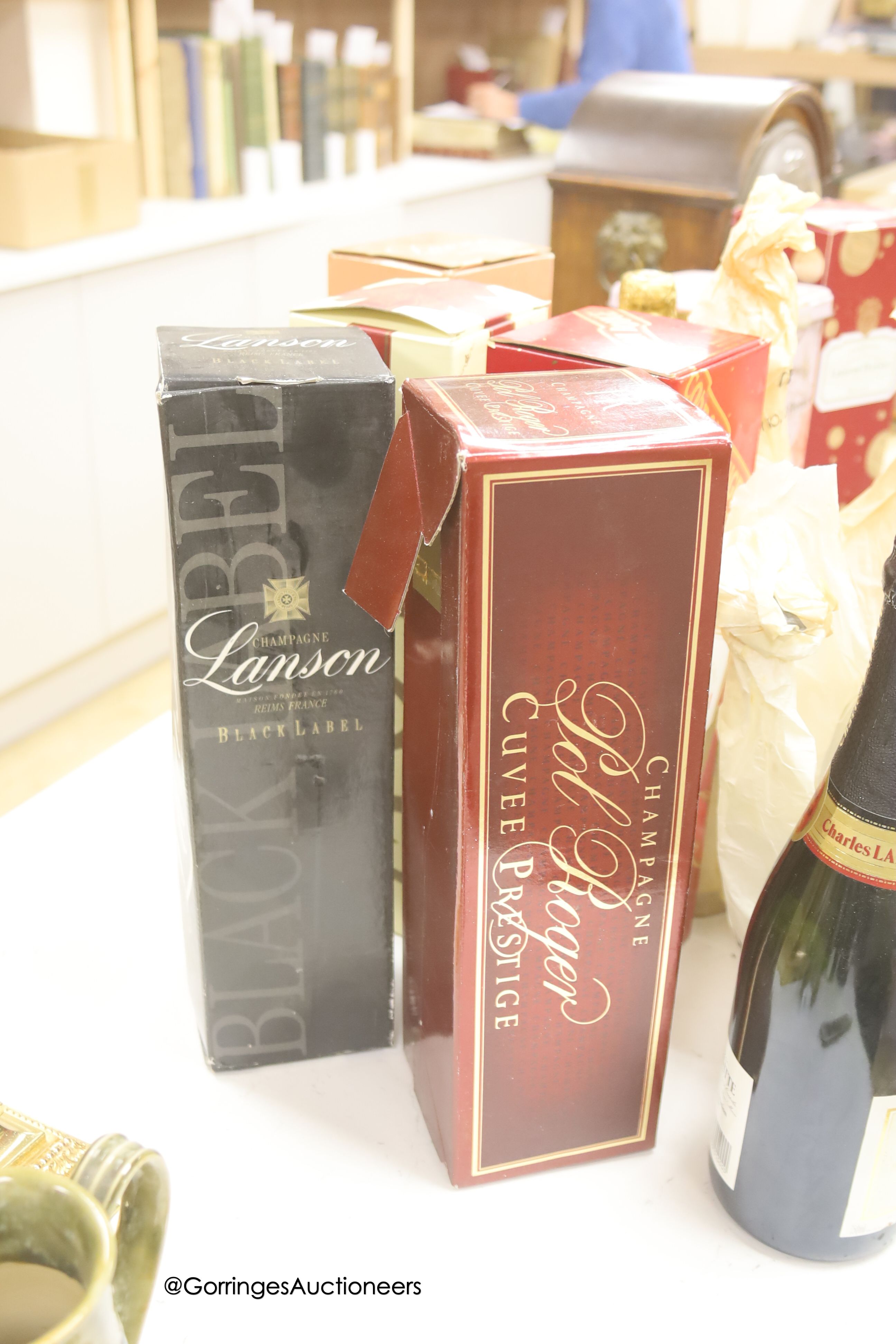 Twelve assorted bottles of champagne including Lanson Pol Roger Jean Rocher and wine related items